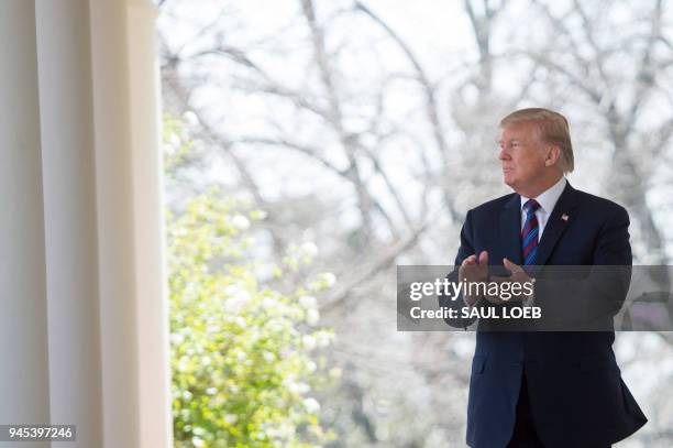 President Donald Trump arrives to speak about tax cuts during an event with American workers in the Rose Garden of the White House in Washington, DC,...