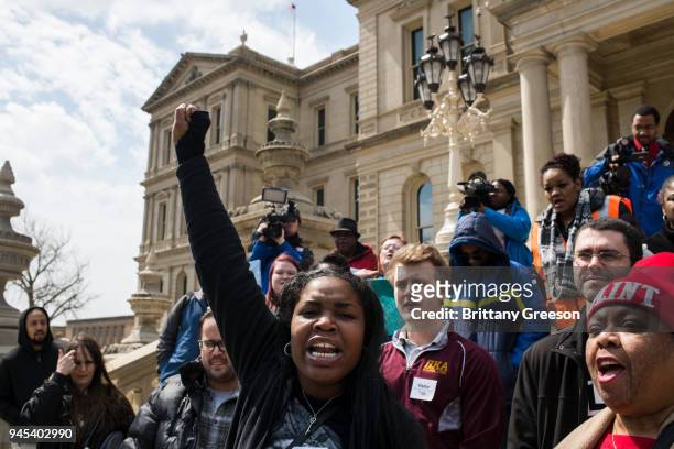 Ariana Hawk of Flint, Michigan, leads a chant during a protest on the steps of the Michigan State Capitol on April 11, 2018 in Lansing, Michigan. The...