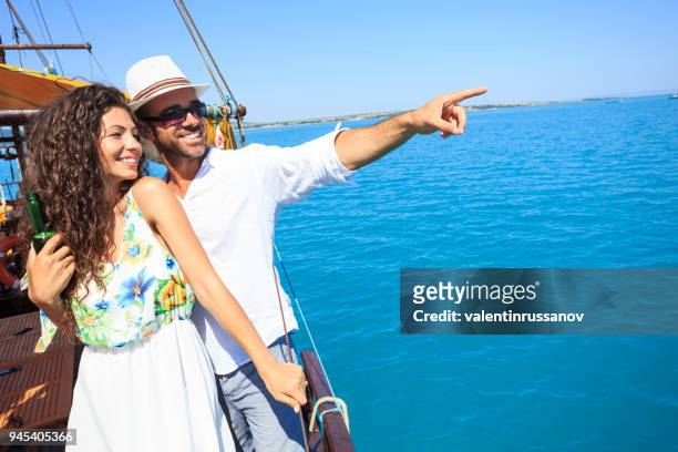 couple on romantic trip with boat in the sea - audi summer tour stock pictures, royalty-free photos & images