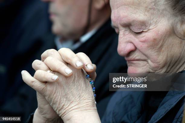 Woman prays as she joins opponents of a treaty safeguarding women, backed by the Roman Catholic Church, protest against its ratification arguing it...