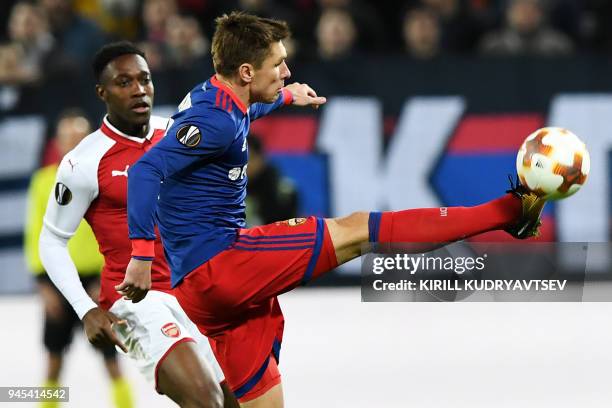 Moscow's Russian defender Kirill Nababkin vies for the ball against Arsenal's English striker Danny Welbeck during the UEFA Europa League second leg...