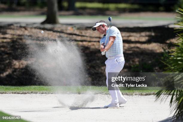 Luke Donald of England plays a shot from a greenside bunker on the seventh hole during the first round of the 2018 RBC Heritage at Harbour Town Golf...