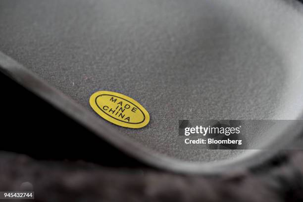 The words "Made In China" are seen on a sticker displayed for a photograph in Tiskilwa, Illinois, U.S., on Thursday, April 12, 2018. A week after...