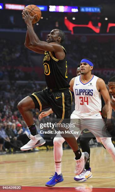 Andre Ingram of the Los Angeles Lakers gets past Tobias Harris of the LA Clippers in the first half at Staples Center on April 11, 2018 in Los...