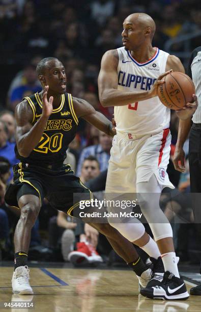 Rookie players Andre Ingram of the Los Angeles Lakers and C.J. Williams of the LA Clippers square off in the first quarter at Staples Center on April...