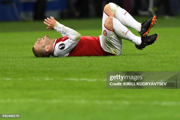 Arsenal's English midfielder Jack Wilshere reacts during the UEFA Europa League second leg quarter-final football match between CSKA Moscow and...