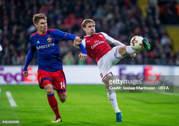 Nacho Monreal of Arsenal clears the ball against Kirill Nababkin of CSKA Moskva during the UEFA Europa League quarter final leg two match between...