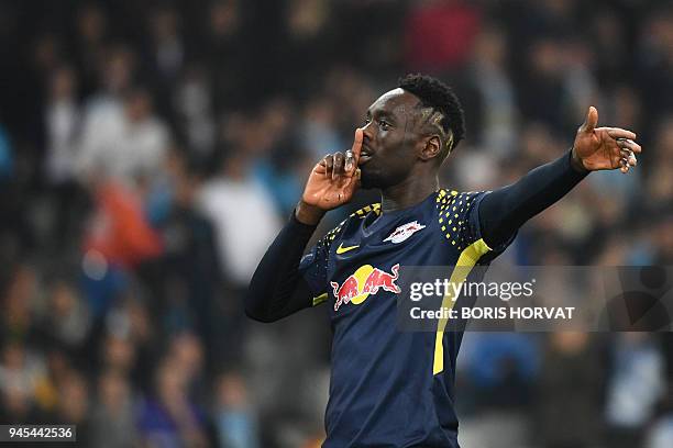 Leipzig's French forward Jean-Kevin Augustin gestures after the second goal, during the Europa League quarter final second leg football match...