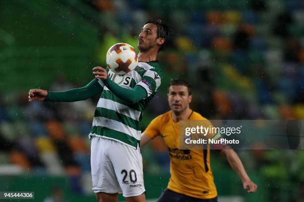 Sporting's forward Bryan Ruiz from Costa Rica vies with Atletico Madrids midfielder Gabi of Spain during the UEFA Europa League second leg football...