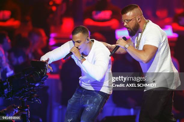 German rappers Kollegah & Farid Bang perform during the 2018 Echo Music Awards ceremony on April 12, 2018 in Berlin. / AFP PHOTO / AXEL SCHMIDT