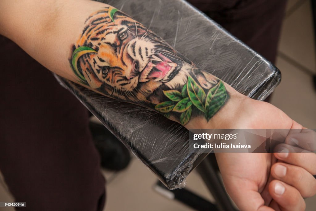 Wrist With Tiger Tattoo High-Res Stock Photo - Getty Images