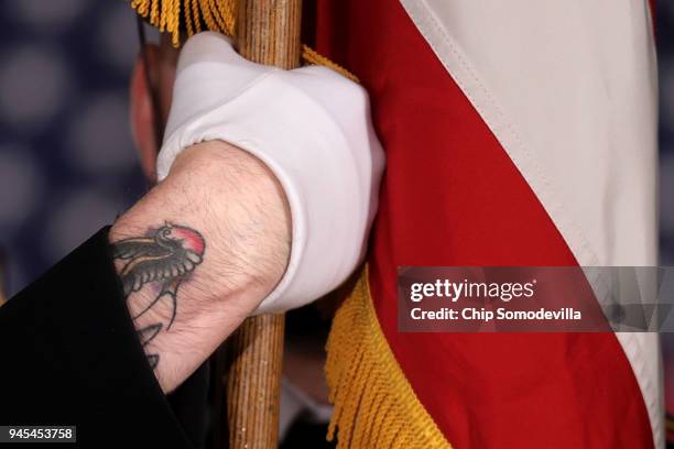 Member of th U.S. Capitol Police Honor Guard holds the U.S. Flag during a ceremony to mark the 50th anniversary of the assassination of Dr. Martin...