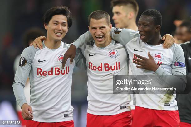 Stefan Lainer of Salzburg celebrates victory with his team mates Takumi Minamino and Amadou Haidara after winning the UEFA Europa League quarter...