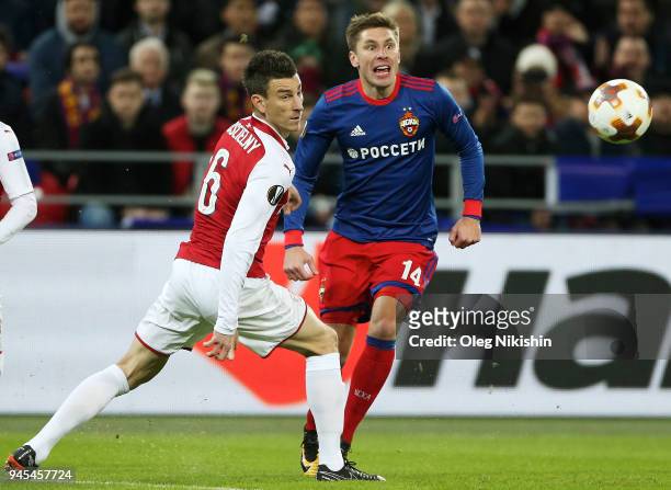 Kirill Nababkin of PFC CSKA Moskva vies for the ball with Laurent Koscielny of Arsenal FC during the UEFA Europa League quarter final leg two match...