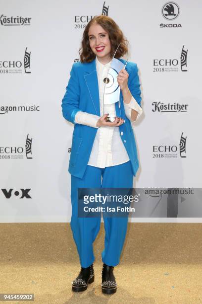 Alice Merton poses with her award for National Pop Female Artist during the Echo Award winners board at Messe Berlin on April 12, 2018 in Berlin,...