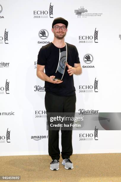 Mark Forster poses with his award for 'Best Male Artist - Pop National' during the Echo Award winners board at Messe Berlin on April 12, 2018 in...
