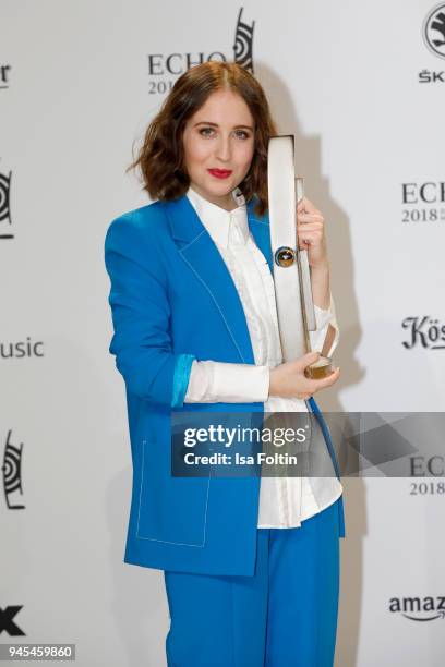 Alice Merton poses with her award for National Pop Female Artist during the Echo Award winners board at Messe Berlin on April 12, 2018 in Berlin,...