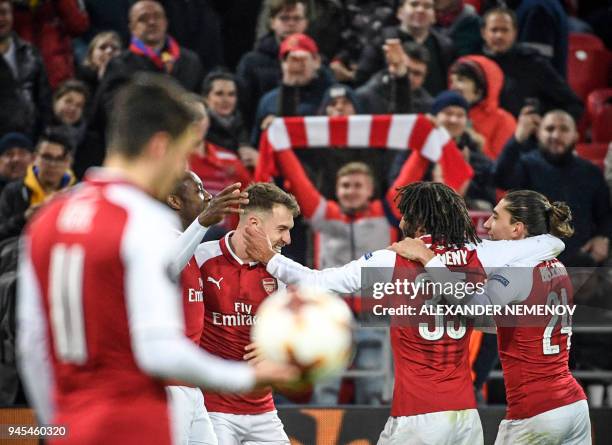 Arsenal's players celebrate a goal during the UEFA Europa League second leg quarter-final football match between CSKA Moscow and Arsenal at VEB Arena...