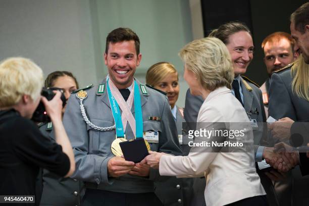 German Defence Minister Ursula von der Leyen hands over a medal to Tobias Wendl during a ceremony to honour the members of the Bundeswehr who...