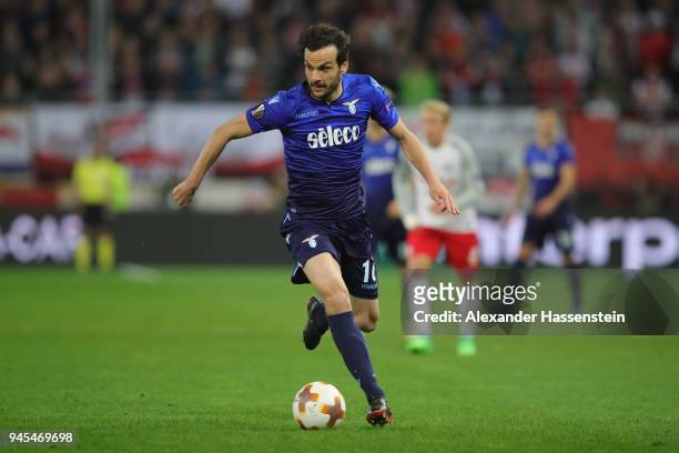 Marco Parolo of Lazio runs with the ball during the UEFA Europa League quarter final leg two match between RB Salzburg and Lazio Roma at Stadion...