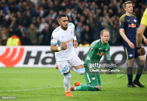 Dimitri Payet of OM celebrates scoring the fourth goal for Marseille while goalkeeper of RB Leipzig Peter Gulacsi reacts during the UEFA Europa...