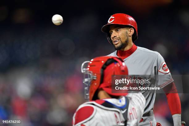 Cincinnati Reds center fielder Billy Hamilton makes a funny face at the ball as it sails past him during the MLB game between the Cincinnati Reds and...