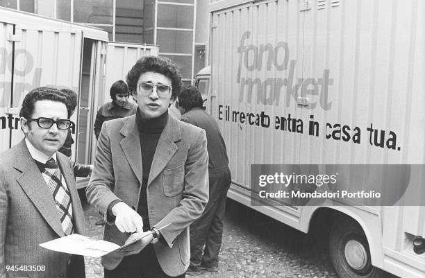 The sales manager at Fonomarket Roberto Formigoni beside Roberto Catanzaro. Fonomarket provides the home delivery for any sort of groceries by phone....