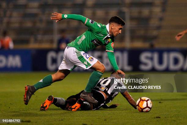 Brazil's Botafogo player Leonardo Valencia vies for the ball with Chile's Audax Italiano player Nicolas Fernandez during their Copa Sudamericana...