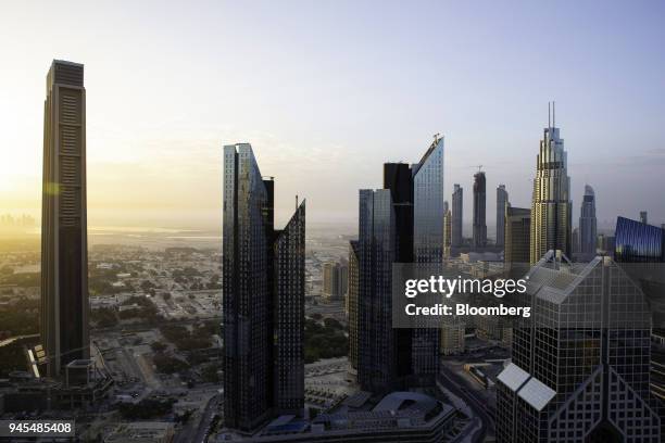 The Central Park Towers, center, stand at the Dubai International Financial Center in Dubai, United Arab Emirates, on Wednesday, April 11, 2018....