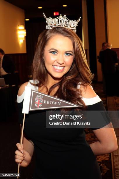 Miss America 2018 Cara Mund, a graduate of Brown University, holds a school flag presented to her by a Brown University Alumni at the Metropolitan...