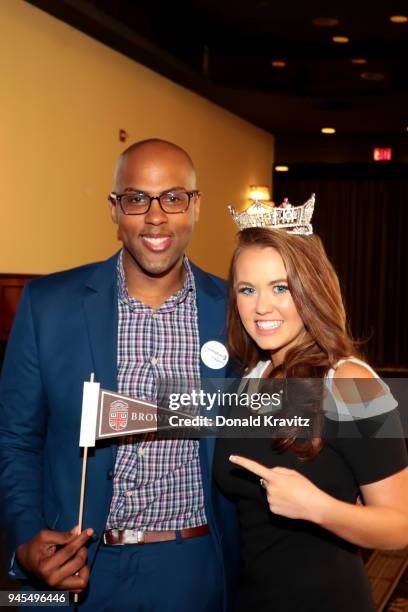 William Cunningham, Brown University Alumni presents Miss America 2018 Cara Mund also a graduate of Brown University a school flag at the...