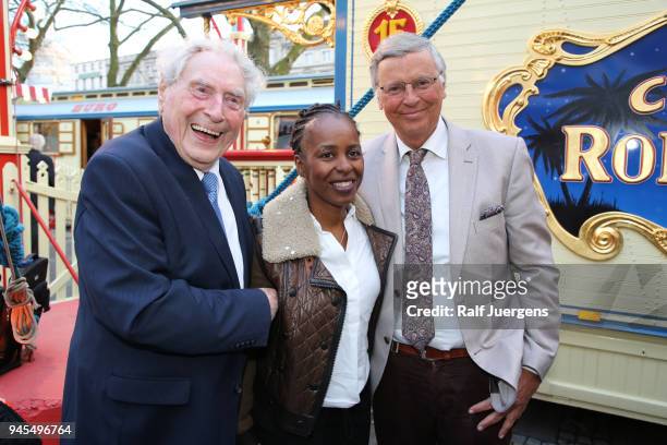 Ludwig Sebus, Shary Reeves and Wolfgang Bosbach attend the premiere of the Circus Roncalli show 'Storyteller' on April 12, 2018 in Cologne, Germany.