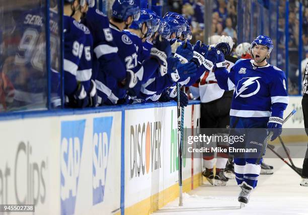 Tyler Johnson of the Tampa Bay Lightning celebrates a goal during Game One of the Eastern Conference First Round against the New Jersey Devils during...