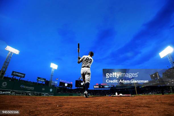 Aaron Judge of the New York Yankees warms up in the on deck circle before a game against the Boston Red Sox at Fenway Park on April 12, 2018 in...