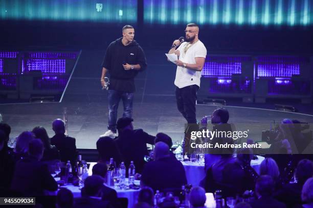 Hip-Hop/Urban - National' award winners Farid Bang and Kollegah speak on stage during the Echo Award show at Messe Berlin on April 12, 2018 in...