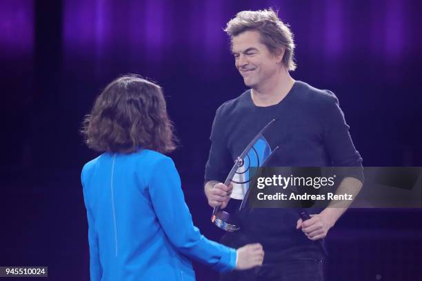 Alice Merton and 'Rock - National' award winner Campino of Die Toten Hosen are seen on stage during the Echo Award show at Messe Berlin on April 12,...