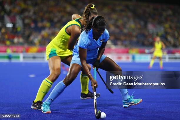 Sunita Lakra of India battles for the ball with Grace Stewart of Australia during Women's Semifinal hockey match between Australia and India on day...