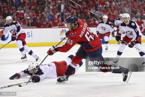 Andre Burakovsky of the Washington Capitals shoots in front of Seth Jones of the Columbus Blue Jackets in the second period in Game One of the...