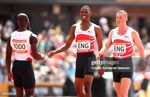 Reuben Arthur of England, Zharnel Hughes of England and Richard Kilty of England celebrate after the Men's 4x100 metres relay heats during Athletics...