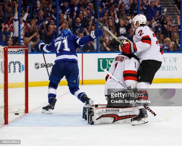 Anthony Cirelli of the Tampa Bay Lightning celebrates a goal against goalie Keith Kinkaid and John Moore of the New Jersey Devils in Game One of the...