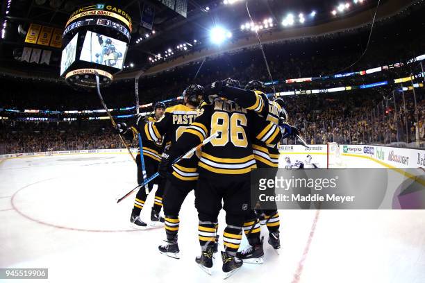 Sean Kuraly of the Boston Bruins, right, celebrates with Kevan Miller, David Pastrnak and Zdeno Chara after scoring a goal against the Toronto Maple...