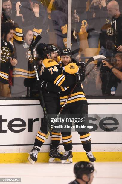 Jake DeBrusk and David Krejci of the Boston Bruins celebrate the goal against the Toronto Maple Leafs during the First Round of the 2018 Stanley Cup...