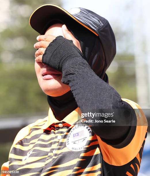 Emma Firyana Saroji of Malaysia shows emotion after winning the women's pairs gold medal match between Colleen Piketh and Nicolene Neal of South...