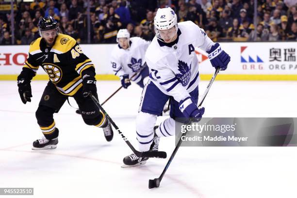 David Krejci of the Boston Bruins defends Tyler Bozak of the Toronto Maple Leafs during the third period of Game One of the Eastern Conference First...