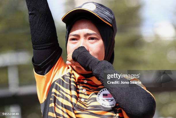 Emma Firyana Saroji of Malaysia shows emotion after winning the women's pairs gold medal match between Colleen Piketh and Nicolene Neal of South...