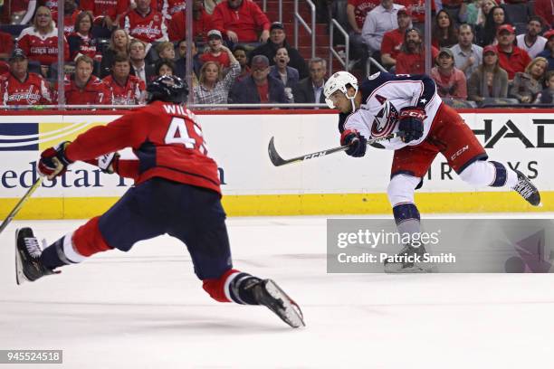 Seth Jones of the Columbus Blue Jackets scores a goal in front of Tom Wilson of the Washington Capitals in the third period in Game One of the...