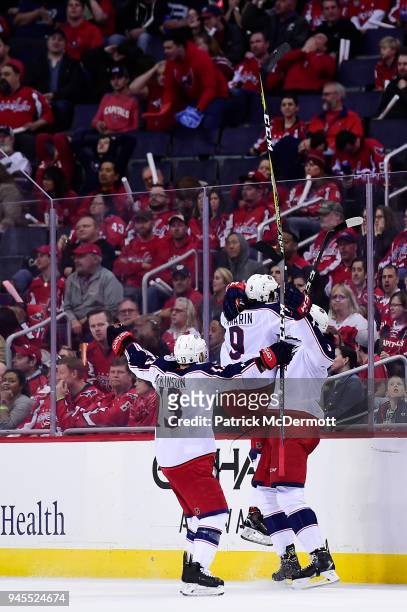 Seth Jones of the Columbus Blue Jackets celebrates with his teammates after scoring a third period goal against the Washington Capitals in Game One...