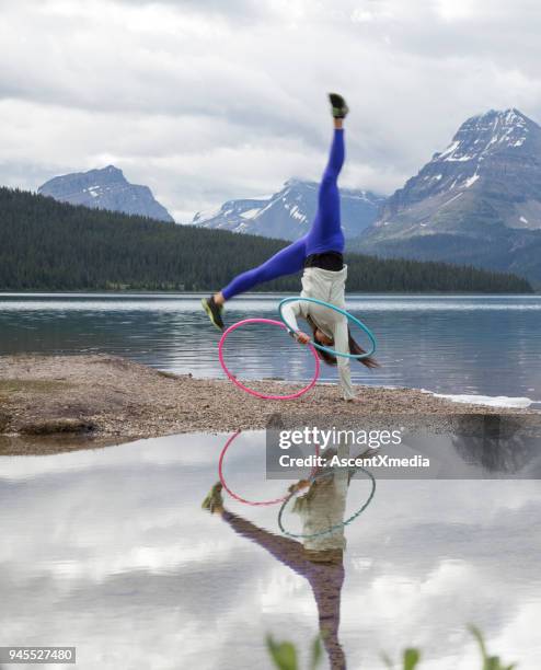 native american woman dances with hoops, in mountains - hooping stock pictures, royalty-free photos & images