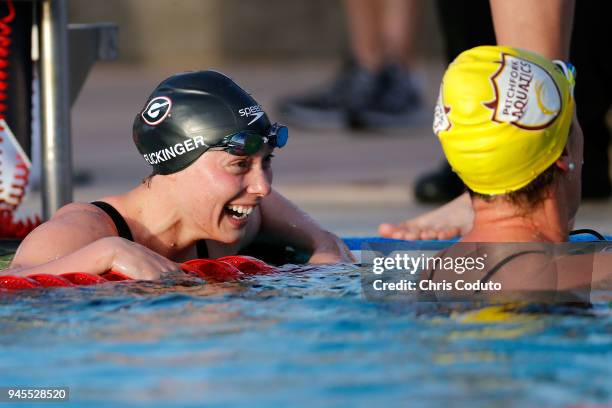 Hali Flickinger smiles at Allison Schmitt after the final of the 200 meter freestyle on day one of the TYR Pro Swim Series at Mesa at Skyline...