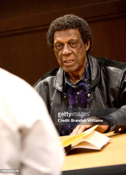 Former professional basketball player Elgin Baylor signs copies of his new book "Hang Time: My Life in Basketball" at Barnes & Noble at The Grove on...